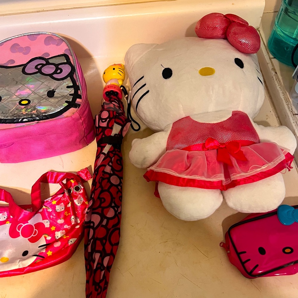 Multiple hello Kitty bags and umbrella